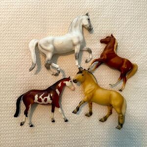 Lot of four Breyer horses